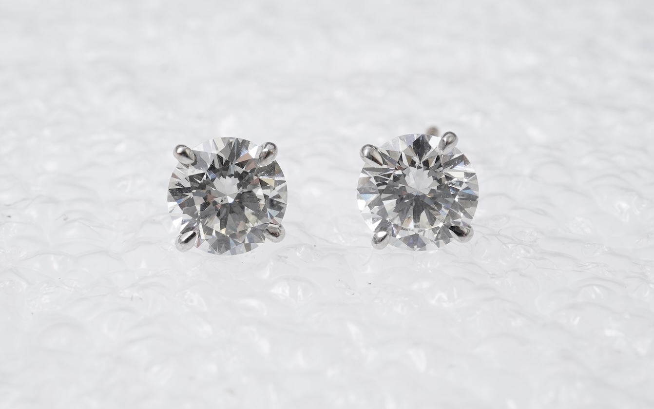 A pair of diamond stud earrings